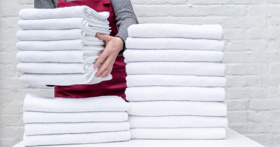 Towel Laundry Towels Being Stacked 1200X800